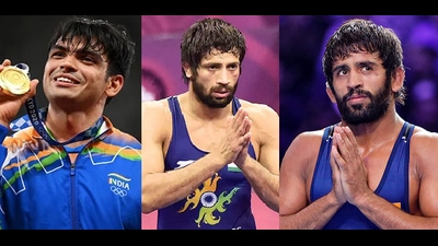 Javelin thrower Neeraj Chopra, wrestlers Ravi Dahiya and Bajrang Punia were given cheques of ₹6 crore, ₹4 crore and ₹2.5 crore, respectively. (HT Photo) Javelin thrower Neeraj Chopra, wrestlers Ravi Dahiya and Bajrang Punia were given cheques of ₹6 crore, ₹4 crore and ₹2.5 crore, respectively. (HT Photo)