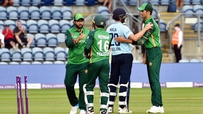 England's Dawid Malan, 2nd right, reacts with Pakistan's Shaheen Shah Afridi, right. (AP)