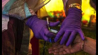 A doctor uses pulse oximeter to examine a person during a free medical camp. (AP file photo) A doctor uses pulse oximeter to examine a person during a free medical camp. (AP file photo)
