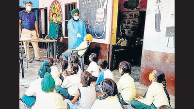 A health department worker collecting samples from students at Government Primary School. Jagraon, on Friday. (HT Photo) A health department worker collecting samples from students at Government Primary School. Jagraon, on Friday. (HT Photo)