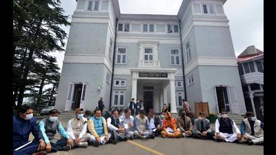 Congress legislators sitting outside the Himachal Pradesh assembly after walking out in protest against the Speaker in Shimla on Friday. (Deepak Sansta/HT) Congress legislators sitting outside the Himachal Pradesh assembly after walking out in protest against the Speaker in Shimla on Friday. (Deepak Sansta/HT)