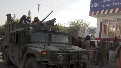 Taliban fighters stand guard at a checkpoint in Kunduz city, northern Afghanistan. (File Photo/AP)