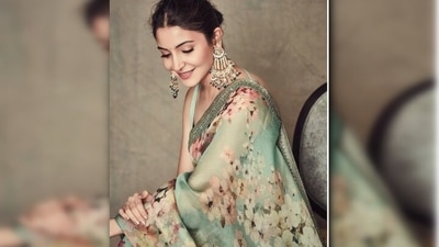 Anushka Sharma picked a mint green, floral print saree by Sabyasachi for an event in Mumbai. She added some drama to her look by accessorising it with a pair of chaandbalis. (Instagram/@anushkasharma) Anushka Sharma picked a mint green, floral print saree by Sabyasachi for an event in Mumbai. She added some drama to her look by accessorising it with a pair of chaandbalis. (Instagram/@anushkasharma)