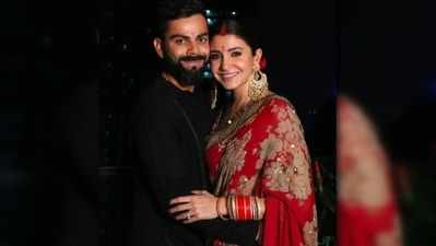 For her first Karwa Chauth, Anushka Sharma opted for a red floral Sabyasachi saree while her husband Virat Kohli wore a black kurta by Antar-Agni. (Instagram/@anushkasharma) For her first Karwa Chauth, Anushka Sharma opted for a red floral Sabyasachi saree while her husband Virat Kohli wore a black kurta by Antar-Agni. (Instagram/@anushkasharma)