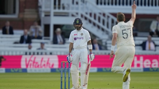 England's Ollie Robinson celebrates as he takes the wicket of India's Virat Kohli during the 2nd cricket test at Lord's cricket ground in London.(AP)
