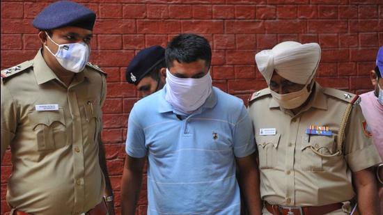 Accused Kailash Bhatt, 31, in the Chandigarh Police custody on Friday. (Keshav Singh/HT)