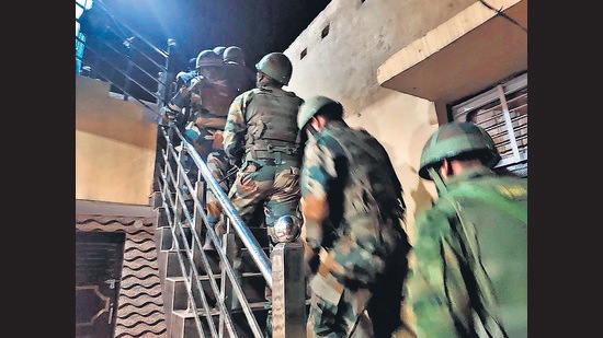 Security personnel check BJP leader Jasbir Singh's house, in Jammu and Kashmir's Rajouri district on August 12. (PTI)