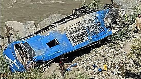 A bus that plunged into a ravine following a bomb attack in Kohistan district of Pakistan’s Khyber Pakhtunkhwa province on July 14, 2021. (AFP/File)