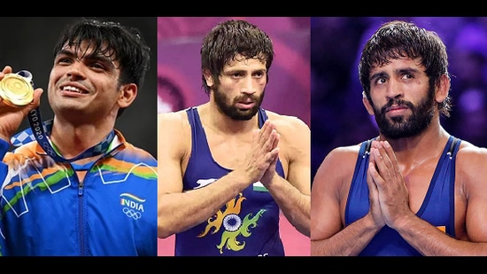 Javelin thrower Neeraj Chopra, wrestlers Ravi Dahiya and Bajrang Punia were given cheques of ₹6 crore, ₹4 crore and ₹2.5 crore, respectively. (HT Photo)