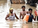 People wade through a flooded street after heavy rainfall, in Patna on Friday. The IMD has forecast fairly widespread rainfall to continue over Bihar.(ANI Photo) People wade through a flooded street after heavy rainfall, in Patna on Friday. The IMD has forecast fairly widespread rainfall to continue over Bihar.(ANI Photo)