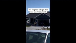 The image shows the kids playing instruments.