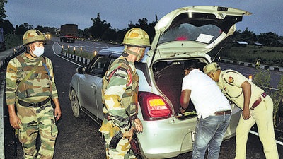 Dibrugarh: Army and Assam police personnel check vehicles at the national highway Khanikar on the eve of 75th Independence Day, at Dibrugarh on August 14, 2021. (PTI Photo) Dibrugarh: Army and Assam police personnel check vehicles at the national highway Khanikar on the eve of 75th Independence Day, at Dibrugarh on August 14, 2021. (PTI Photo)