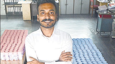 Akarsh Tekriwal, founder of Safecup, poses with his products at his unit in Wagholi, Pune. (Shankar Narayan/HT PHOTO) Akarsh Tekriwal, founder of Safecup, poses with his products at his unit in Wagholi, Pune. (Shankar Narayan/HT PHOTO)