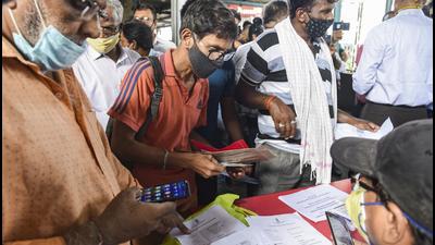 Passengers who have taken two doses of Covid-19 vaccine, show their certificates as they are allowed to travel by local train, at Dadar Railway Station. (PTI) Passengers who have taken two doses of Covid-19 vaccine, show their certificates as they are allowed to travel by local train, at Dadar Railway Station. (PTI)