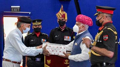 Punjab governor VP Singh Badnore felicitates army veterans as part of the Swarnim Vijay Varsh anniversary of the 1971 war victory against Pakistan, during his visit to the Vajra Corps, at Jalandhar Cantt on Saturday. (PTI)