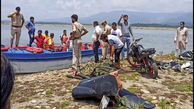 Police and NDRF personnel at the site after a helicopter of the Indian Army crashed near Ranjit Sagar Dam Lake in Kathua district. (PTI)