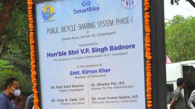 The board put up at the launch of the bicycle sharing initiative said the project was launched in the presence of Chandigarh MP Kirron Kher, while she is in Mumbai, undergoing cancer treatment. (Keshav Singh/HT) The board put up at the launch of the bicycle sharing initiative said the project was launched in the presence of Chandigarh MP Kirron Kher, while she is in Mumbai, undergoing cancer treatment. (Keshav Singh/HT)