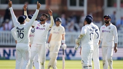 India's Mdohammed Siraj, second left celebrates with team mates after taking the wicket of England's Ollie Robinson lbw during the third day of the 2nd cricket test between England and India at Lord's cricket ground in London (AP) India's Mdohammed Siraj, second left celebrates with team mates after taking the wicket of England's Ollie Robinson lbw during the third day of the 2nd cricket test between England and India at Lord's cricket ground in London (AP)