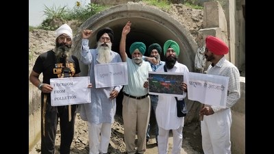 Members of various NGOs protesting at Dhanansu village in Ludhiana on Saturday. (HT Photo)