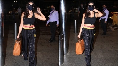 To accessorise the street-ready attire, Nora chose large gold hoop earrings. She also carried an expensive Fendi Roma Sunshine large tan tote bag with the attire. The bag is worth <span class='webrupee'>₹</span>2,31,354 (QR 11,350). (Varinder Chawla) To accessorise the street-ready attire, Nora chose large gold hoop earrings. She also carried an expensive Fendi Roma Sunshine large tan tote bag with the attire. The bag is worth <span class='webrupee'>₹</span>2,31,354 (QR 11,350). (Varinder Chawla)