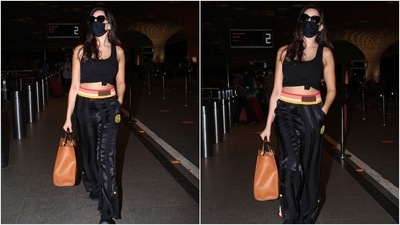 Nora teamed the top with black Fendi joggers featuring a multi-coloured band, shiny black strips and a gathered hem. She completed her look with black lace-up chunky shoes and sunglasses. (Varinder Chawla) Nora teamed the top with black Fendi joggers featuring a multi-coloured band, shiny black strips and a gathered hem. She completed her look with black lace-up chunky shoes and sunglasses. (Varinder Chawla)