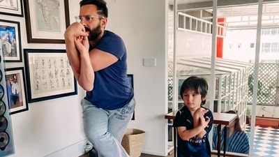 Saif Ali Khan and Taimur during a yoga session. Saif Ali Khan and Taimur during a yoga session.