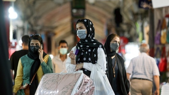 An Iranian woman wearing a face mask walks in Tehran Bazaar, as the coronavirus disease (COVID-19) cases spike, in Tehran, Iran. (via Reuters)