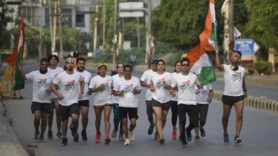 A group of residents march with the national flag in Sector 50 on the occasion of Independence Day. (Parveen Kumar/HT Photo) A group of residents march with the national flag in Sector 50 on the occasion of Independence Day. (Parveen Kumar/HT Photo)