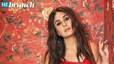 Kareena Kapoor posed in a red cowl-neck dress against a wall with floral wallpaper. (Rohan Shrestha for HT Brunch) Kareena Kapoor posed in a red cowl-neck dress against a wall with floral wallpaper. (Rohan Shrestha for HT Brunch)