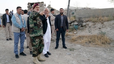 Afghanistan's president Ashraf Ghani and acting defence minister Bismillah Khan Mohammadi visit the military corps in Kabul, Afghanistan, on August 14, 2021. &nbsp; (Afghan Presidential Palace/Handout via REUTERS)
