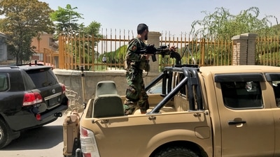 An Afghan soldier stands in a military vehicle on a street in Kabul, Afghanistan on Sunday.&nbsp; (REUTERS)