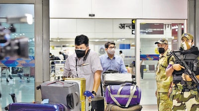 Passengers from Kabul arrive at New Delhi airport on Sunday. (Sanjeev Verma/HT photo)