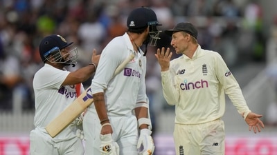 India's Rishabh Pant, left speaks to England's Joe Root, right as they teams come off the pitch for bad light which ended the days play during the fourth day of the 2nd cricket test between England and India at Lord's cricket ground in London, (AP) India's Rishabh Pant, left speaks to England's Joe Root, right as they teams come off the pitch for bad light which ended the days play during the fourth day of the 2nd cricket test between England and India at Lord's cricket ground in London, (AP)