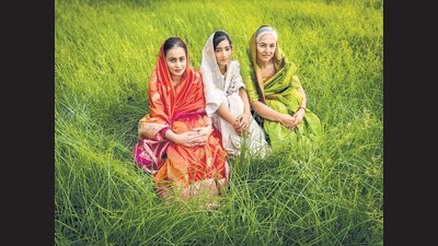 Pure handloom sarees in saffron, green and white colour with Banarasi motifs. It takes 15 days to develop one saree with many craftsmen working on it. (Photo: Jasjeet Plaha/HT) Pure handloom sarees in saffron, green and white colour with Banarasi motifs. It takes 15 days to develop one saree with many craftsmen working on it. (Photo: Jasjeet Plaha/HT)