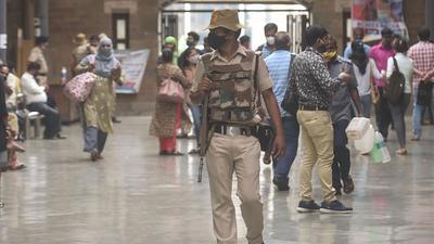 Verification of vaccination certificates and issuing of universal passes was taking place outside railway stations. (PTI) Verification of vaccination certificates and issuing of universal passes was taking place outside railway stations. (PTI)