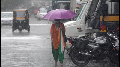 Woman dressed in tricolour walks in rain at Thakur Village, Kandivli. (Vijay Bate/HT) Woman dressed in tricolour walks in rain at Thakur Village, Kandivli. (Vijay Bate/HT)