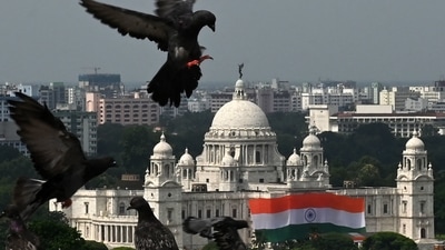 A 7500-sq.ft Indian national flag is pictured hanging from the Victoria Memorial as pigeons fly during India's 75th Independence Day celebrations in Kolkata on August 15. (AFP) A 7500-sq.ft Indian national flag is pictured hanging from the Victoria Memorial as pigeons fly during India's 75th Independence Day celebrations in Kolkata on August 15. (AFP)