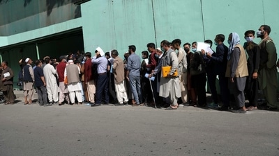 Afghans wait in long lines for hours to get visas in front of the Iranian embassy, in Kabul, on Sunday. (AP) Afghans wait in long lines for hours to get visas in front of the Iranian embassy, in Kabul, on Sunday. (AP)