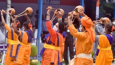 Folk artists perform during the 75th Independence Day celebrations at Red Road in Kolkata on August 15. (PTI) Folk artists perform during the 75th Independence Day celebrations at Red Road in Kolkata on August 15. (PTI)