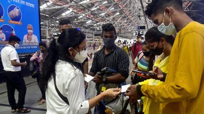 Ticket collectors check railway passes and IDs at CSMT. (Anshuman Poyrekar/HT Photo) Ticket collectors check railway passes and IDs at CSMT. (Anshuman Poyrekar/HT Photo)