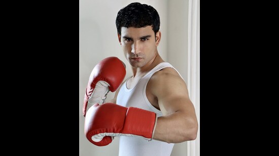 Sculpted arms, boxing gloves and a ribbed white vest is the way to dress this season; Model: Pardeep Kharera (an international boxing champion and actor from Haryana) (Yatan Ahluwalia)