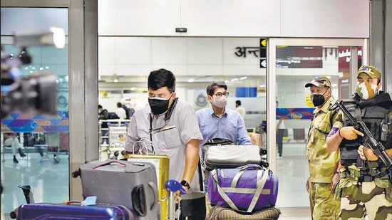 Passengers from Kabul arrive at New Delhi airport on Sunday. (Sanjeev Verma/HT photo)