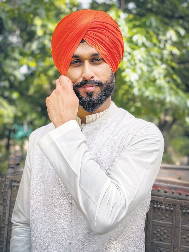 Hand quilted vest, made in silk in elegant white teamed with a saffron turban represents valour, courage and truthfulness, the values imbibed in our soil. (Photo: Jasjeet Plaha/HT)