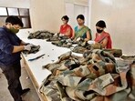 A unit in Khanpur in south Delhi, where military uniforms are repurposed into different products such as bags, masks, aprons, etc. (Sanjeev Verma/HT PHOTO)