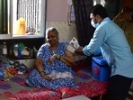 A healthcare worker administers a dose of Covid-19 vaccine to a beneficiary during door-to-door vaccination drive in Mumbai.(Bhushan Koyande/HT File Photo) A healthcare worker administers a dose of Covid-19 vaccine to a beneficiary during door-to-door vaccination drive in Mumbai.(Bhushan Koyande/HT File Photo)