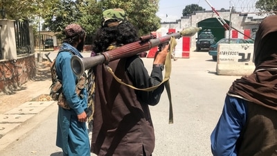 Taliban forces stand guard inside Kabul, Afghanistan. (REUTERS)