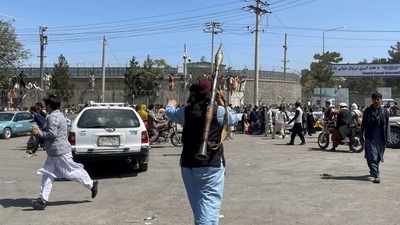 A member of Taliban forces inspects the area outside Hamid Karzai International Airport in Kabul, Afghanistan (REUTERS) A member of Taliban forces inspects the area outside Hamid Karzai International Airport in Kabul, Afghanistan (REUTERS)