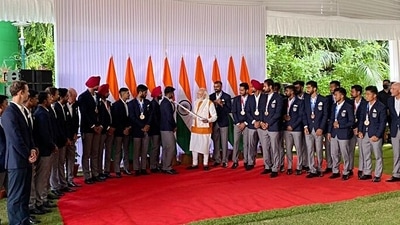 Men's hockey team presents Prime Minister Modi with an autographed hockey during PM's meet with the Tokyo Olympics contingent, in New Delhi on August 16. (ANI) Men's hockey team presents Prime Minister Modi with an autographed hockey during PM's meet with the Tokyo Olympics contingent, in New Delhi on August 16. (ANI)