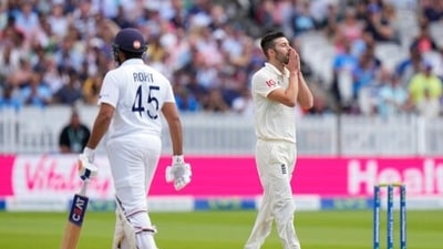 England's bowler Mark Wood, right, reacts after India's Rohit Sharma hit him for six runs. (AP) England's bowler Mark Wood, right, reacts after India's Rohit Sharma hit him for six runs. (AP)
