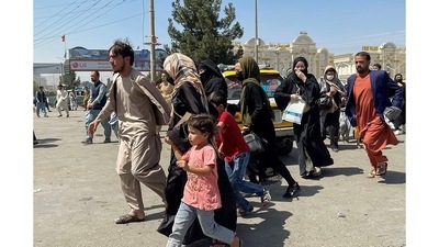 People try to get into Hamid Karzai International Airport in Kabul, Afghanistan August 16, 2021. Major airlines like the United Airlines, British Airways and Virgin Atlantic have said they were not using the country's airspace.&nbsp; (REUTERS)